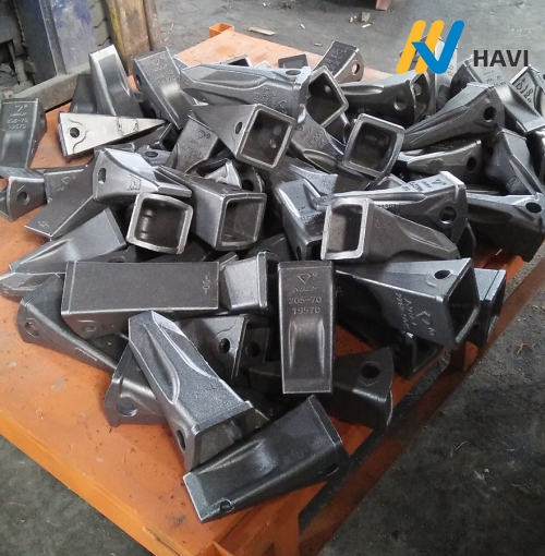 Răng gầu máy xúc